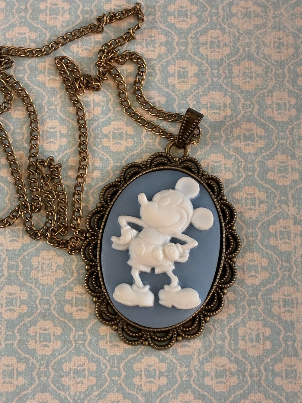 Mickey Mouse blue and white cameo pendant necklace in brass tone setting